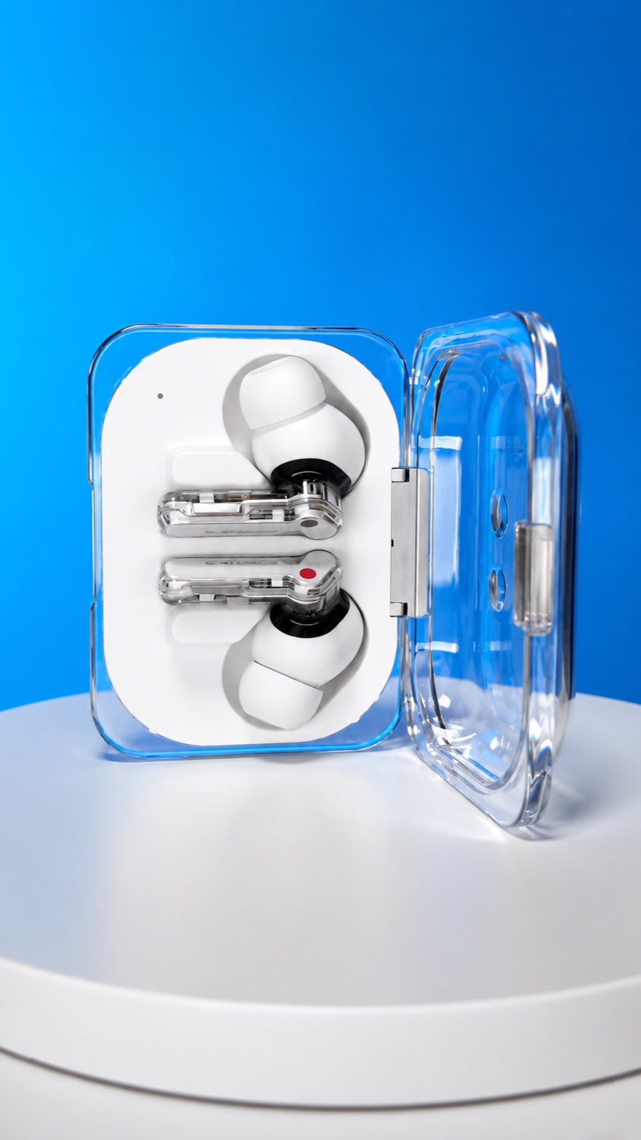 Transparent earbuds case from one of Saqib's reviews, on a blue set