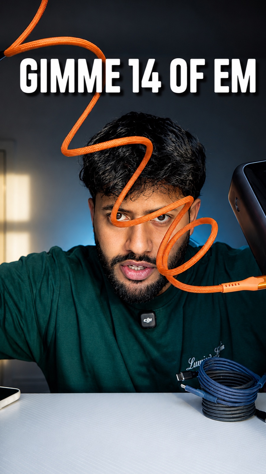 Charging cable review: a coiled orange cable spiraling in front of Saqib