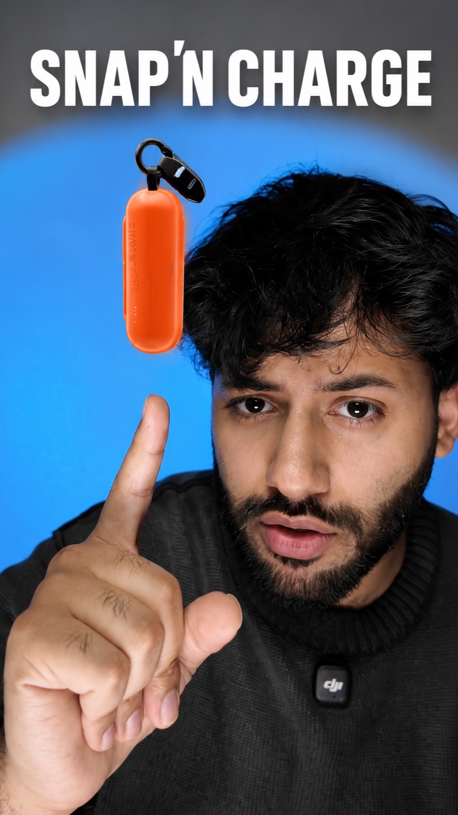 Snap'N Charge power bank balanced on Saqib's fingertip